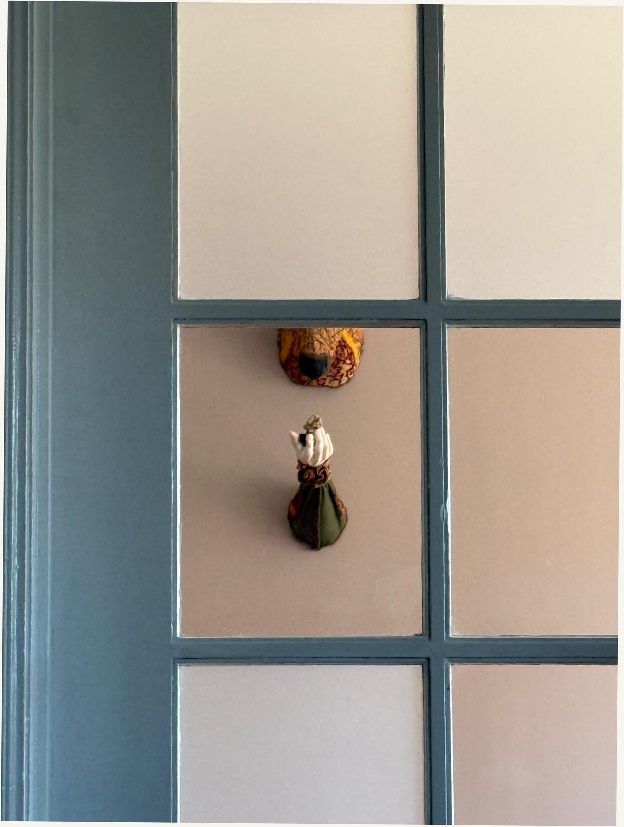 Linen and porcelain against a painted panel door